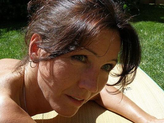 A hot sunbathing mature Lady